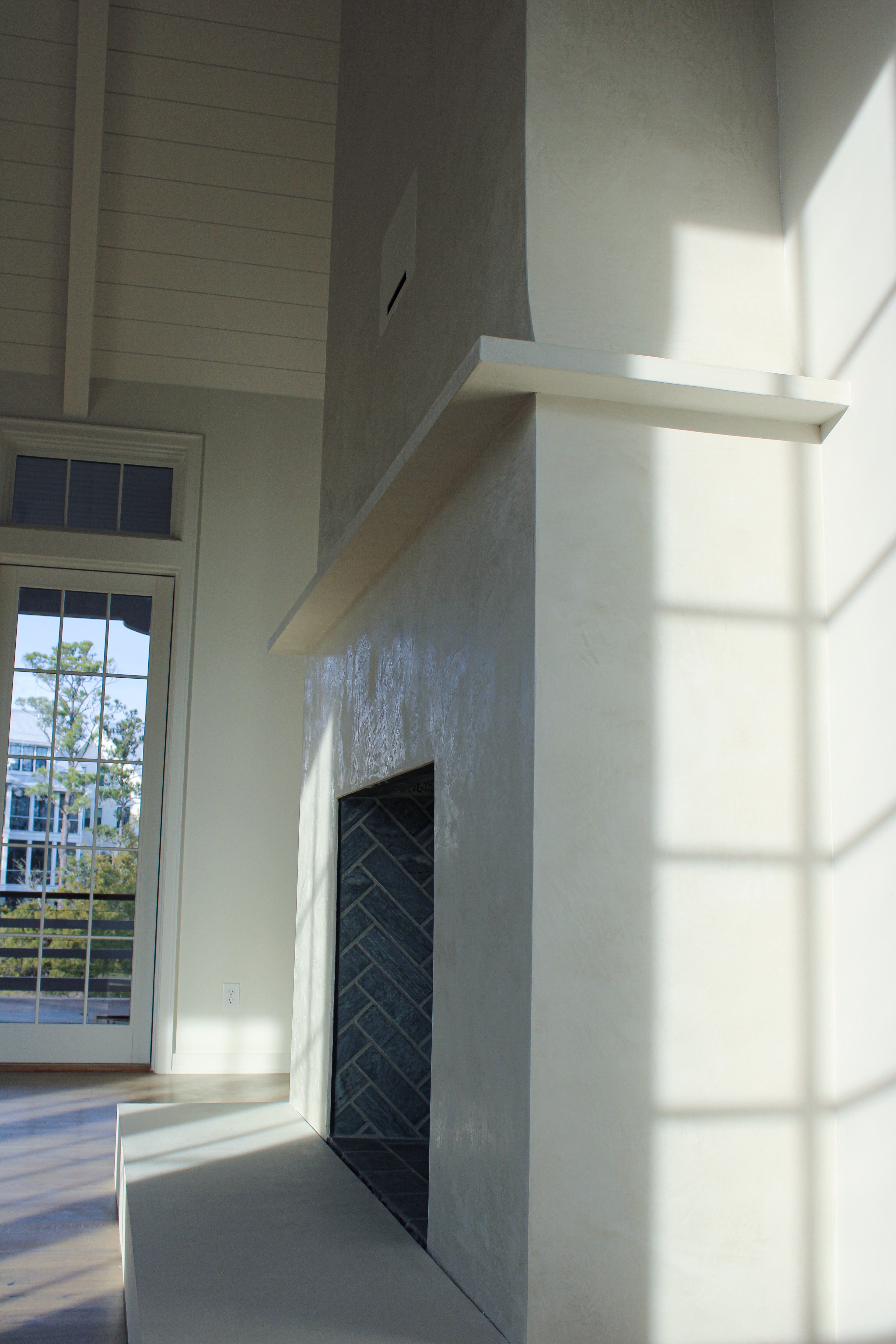 Origami White Venetian Fireplace Side Shot out in Kiawah River for a double store. You can see a slight burnish when the lighting is right.