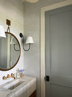 Dusty light blue Venetian plaster in a Daniel Island powder bathroom by Emily Pope Harris, featuring heavy texture and a matte finish, completed with Jackson Built Custom Homes.