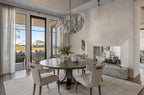 Double-sided fireplace on Kiawah Island with subtle textured plaster, showing gentle movement while allowing the marsh views to remain the focal point.