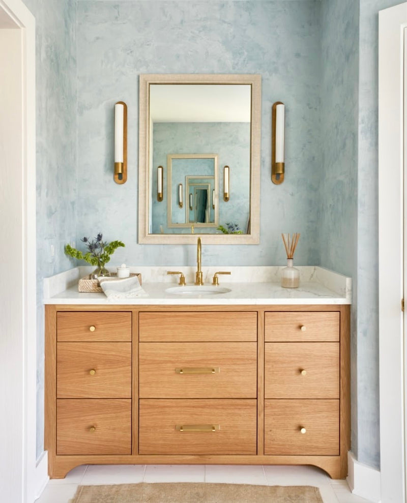 Custom light blue Venetian plaster wall with burnish and polished sheen in a master bathroom at the CSOL Designer Show house in Charleston, SC, designed by PWD Studio.